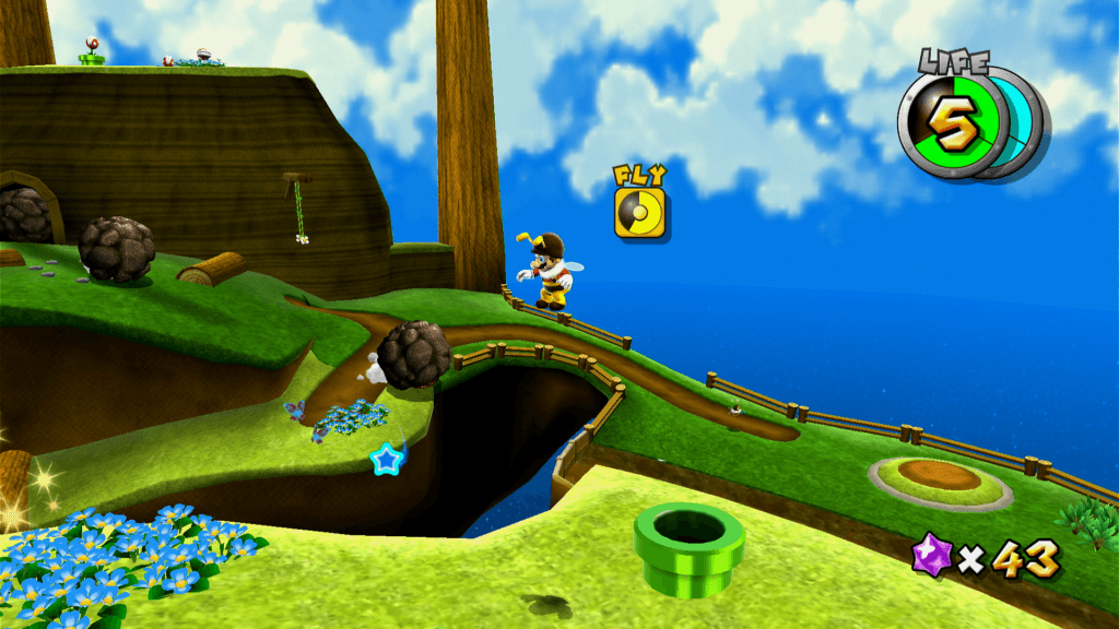 Super Mario 3D All-Stars Administre o vigor para poder voar e alcançar objetivos com o poder de abelha. Não caia na água! (Imagem: Reprodução)